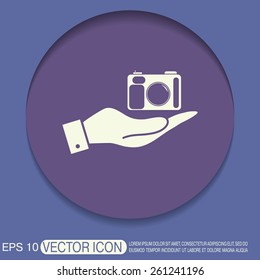 hand holding a photo camera