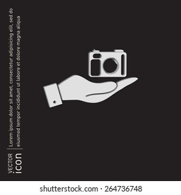 hand holding a photo camera