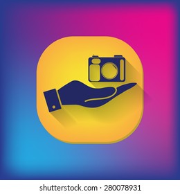 hand holding a photo camera