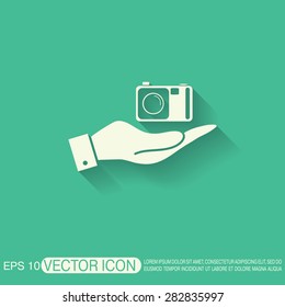 hand holding a photo camera