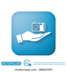 hand holding a photo camera