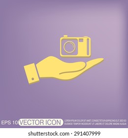 hand holding a photo camera
