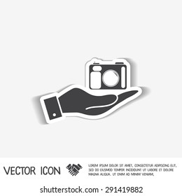 hand holding a photo camera
