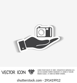 hand holding a photo camera