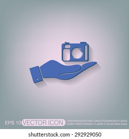 hand holding a photo camera