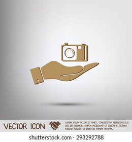 hand holding a photo camera