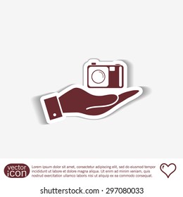 hand holding a photo camera