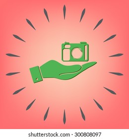 hand holding a photo camera