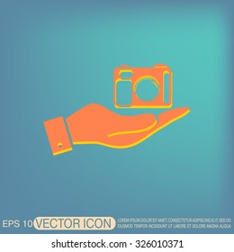 hand holding a photo camera