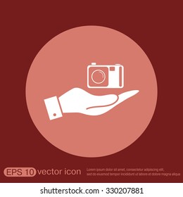 hand holding a photo camera