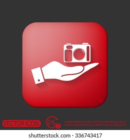 hand holding a photo camera