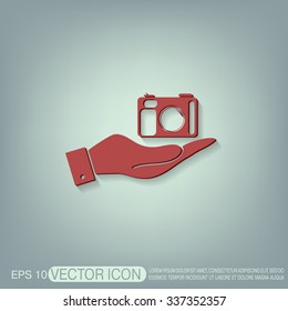 hand holding a photo camera
