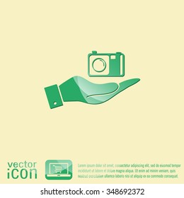 hand holding a photo camera