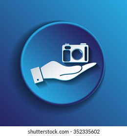 hand holding a photo camera