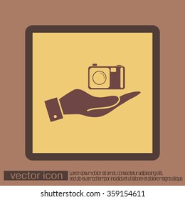 hand holding a photo camera