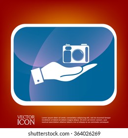 hand holding a photo camera