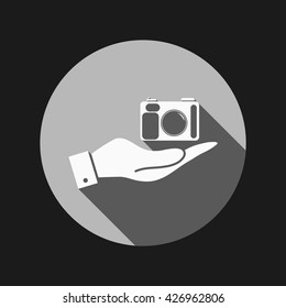 hand holding a photo camera