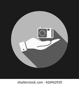 hand holding a photo camera