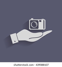 hand holding a photo camera