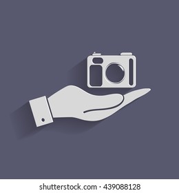 hand holding a photo camera