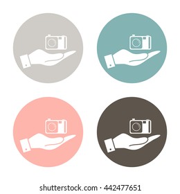 hand holding a photo camera