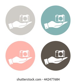 hand holding a photo camera