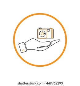 hand holding a photo camera