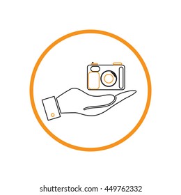 hand holding a photo camera