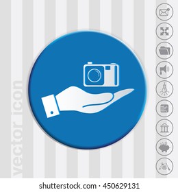 hand holding a photo camera