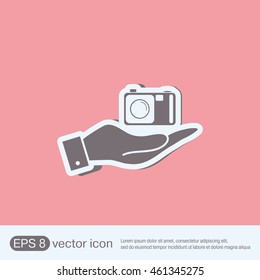 hand holding a photo camera