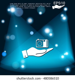 hand holding a photo camera