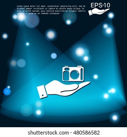 hand holding a photo camera
