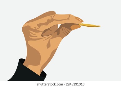 Hand holding  piece of chips isolated on on gray background