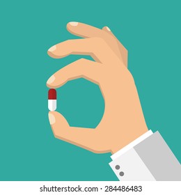 Hand Holding A Pill - Flat Style