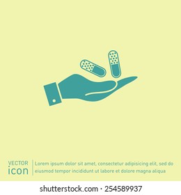 hand holding a pill tablet sign. symbol of medicine and health. icon pills and tablets .
