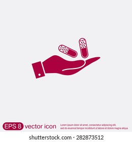 hand holding a pill tablet sign. symbol of medicine and health. icon pills and tablets .