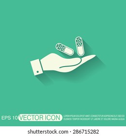 hand holding a pill tablet sign. symbol of medicine and health. icon pills and tablets .