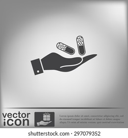 hand holding a pill tablet sign. symbol of medicine and health. icon pills and tablets .