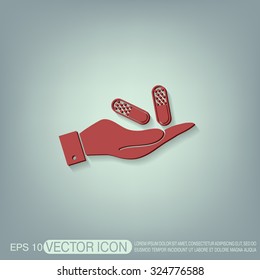 hand holding a pill tablet sign. symbol of medicine and health. icon pills and tablets .