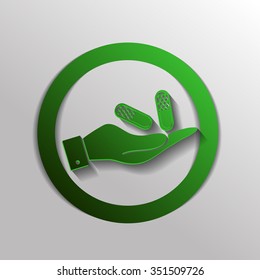 hand holding a pill tablet sign. symbol of medicine and health. icon pills and tablets .