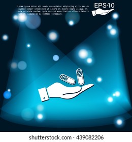 hand holding a pill tablet sign. symbol of medicine and health. icon pills and tablets .