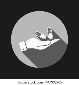 hand holding a pill tablet sign. symbol of medicine and health. icon pills and tablets .