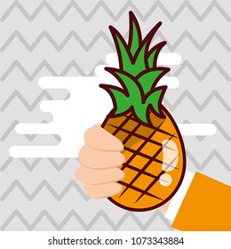 hand holding pineapple fresh colored background