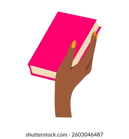 A hand holding a pink book. The book is pink and has a yellow nail polish on the thumb