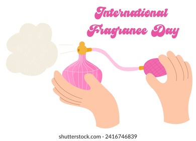 Hand holding a pink parfume. Cologne and fragnance, scent.International Fragrance Day.