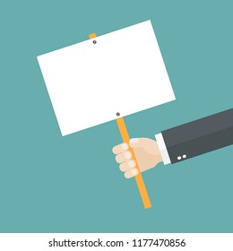 Hand holding a placard with copy space