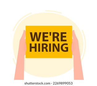 Hand holding placard with space for text we're hiring