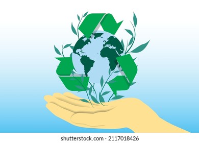 Hand holding planet earth with recycling symbol around it. Care for the environment and responsible use of natural resources