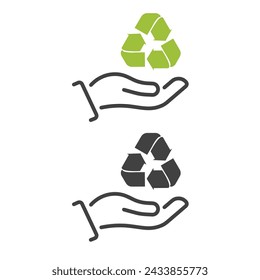 Hand holding planet with recycling symbol.