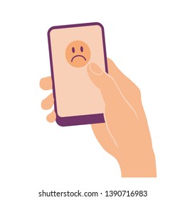 Hand holding and pointing on mobile phone with sad face on screen. Flat design isolated on white.
